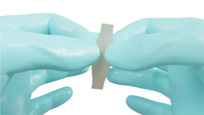 Dentapreg® UFM fiber mesh held between gloved fingers.